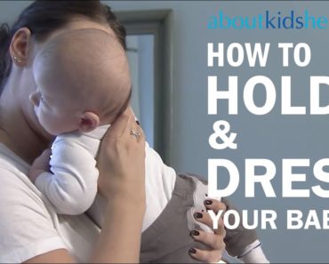 How to hold and dress your newborn baby