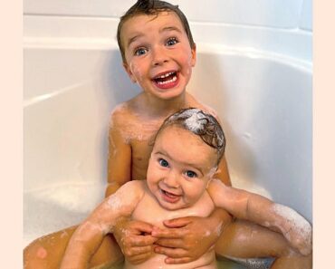 How do you bathe a baby and a toddler at the same time?