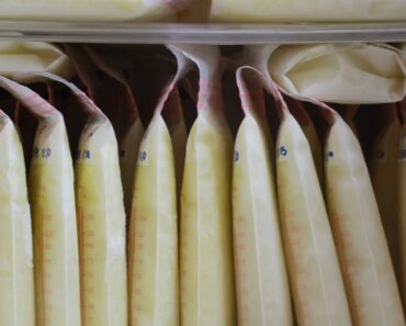 Can warmed breast milk be refrigerated again?